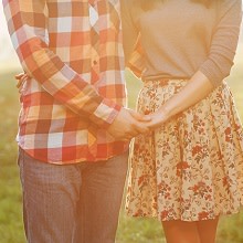 couple holding hands and hugging each other