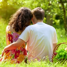 couple having a picnic on the grass